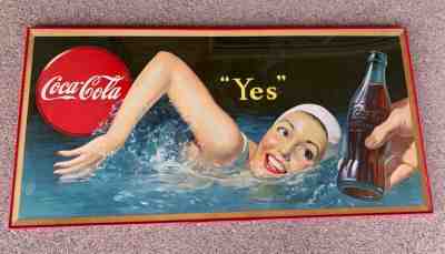 Coca-Cola cardboard sign