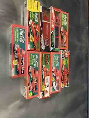 LOT OF 9 COCA COLA LIMITED EDITION COLLECTIBLE SEMI TRUCKS (NIB)