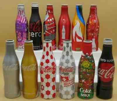 12 Coca-Cola aluminium bottles 250 ml empty, Daft Punk, iTunes, MIKA, Faithless