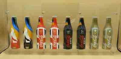 8 Coca-Cola aluminium bottles 250 ml empty in acryl display LONDON 2012 Olympics
