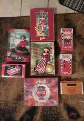 Coca Cola Collectible Lot of 7; 2 Clocks, 2 Barbie Dolls, 3 Musical Banks.