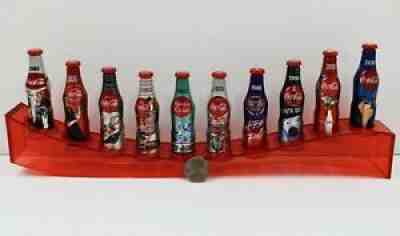 *10 Miniature 3" 100th Anniv aluminum Coca Cola Bottles w 14" Wave Display Stand