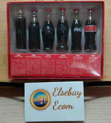 EVOLUTION OF COCA COLA CONTOUR BOTTLES ~ 6 MINIATURE COKE BOTTLES ~ 2002