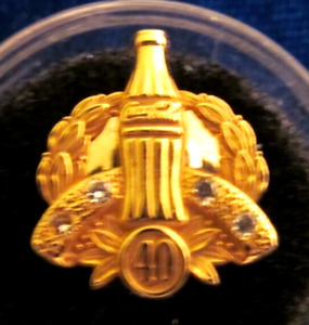 Coca Cola service award pin. marked  10K, 40! years,  4 clear stones, diamonds?