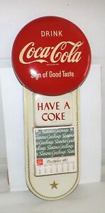 1950'S COCA-COLA "SIGN OF GOOD TASTE" BUTTON CALENDAR SIGN W/1982 UNUSED PAD NM