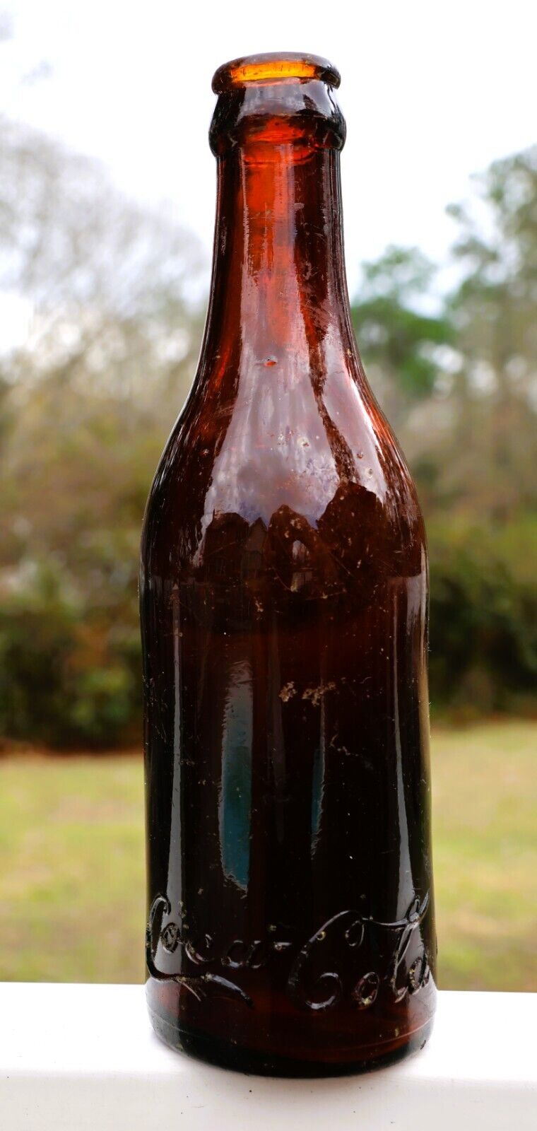 EARLY SCRIPT EMBOSSED STRAIGHT SIDED AMBER COCA COLA BOTTLE ( MEMPHIS, TENN)