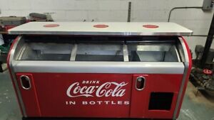 vintage coca cola cooler and bar