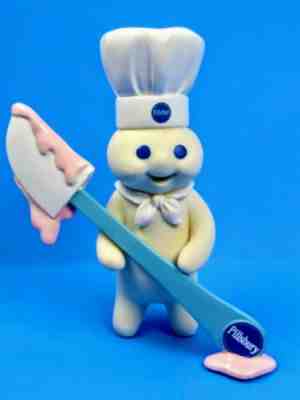 Pillsbury Doughboy collector series figurine spreading it on thick Danbury Mint