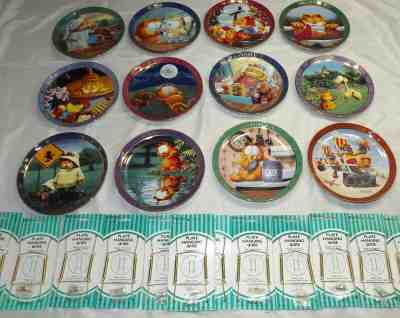 A DAY WITH GARFIELD - ENTIRE 1978 SET 12 PLATES - DANBURY MINT RETIRED + HANGERS