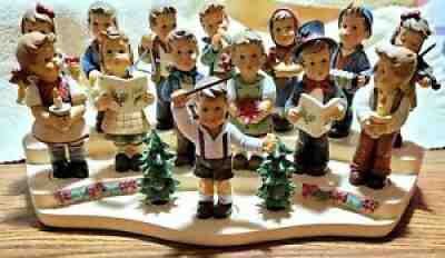 The M.J. Hummel Christmas Choir, 2015, by Danbury Mint, 17 Pieces w/ Platform