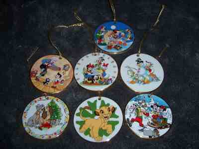 Grolier Collectibles Disney Christmas Porcelain Disc Ornaments, lot of 7