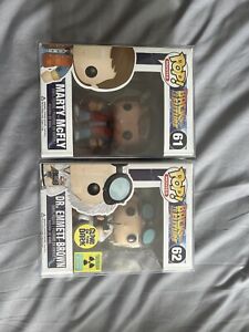 Doctor Emmett Brown glow convention exclusive and Marty Mcfly funko pops