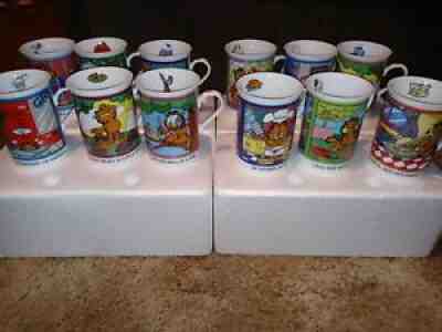 Lot of 12 Garfield Porcelain Collector Mugs - The Danbury Mint. Never used.