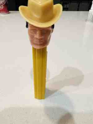 Vintage PEZ Cowboy dispenser, no feet, Red Stem, black hair, olive hat.