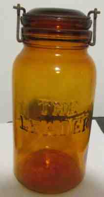 vintage old amber fruit Jar embossed The Leader ground lip correct lid & clamp