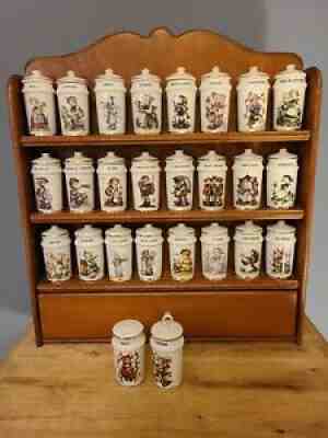 https://collectionhero.s3.us-east-2.amazonaws.com/hummel/hummel-VINTAGE-MJ-1987-PORCELAIN-SPICE-JARS-24-JARS-Salt-Pepper-WOODEN-RACK-636adce5973f2.jpg