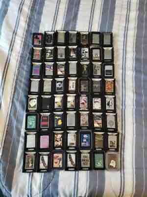 Lot Of 56, Zippo Lighters, Eagle, Beatles, Freedom, Jack Daniels, Jim Beam, Duke