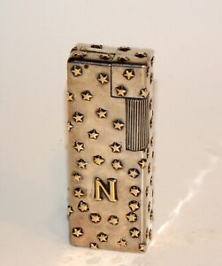 New Listingsuperb art deco French Workshop sterling silver gold star petrol roller lighter