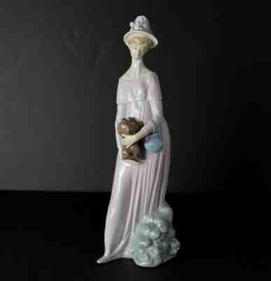 Vintage Lladro Daisa 1978 Porcelain Figure, young woman holding pekinese dog