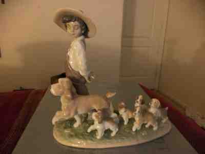 LITTLE EXPLORERS - BOY WITH PUPPY DOGS FIGURINE BY LLADRO PORCELAIN  6828