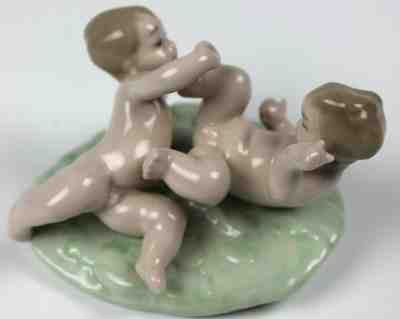 Lladro store tumbling babies porcelain figure