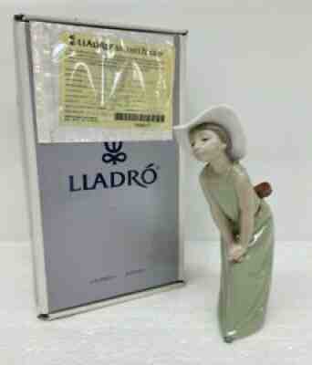 Lladro figurine- deals curious lady with hat