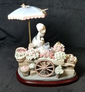 LLADRO #1454 FLOWERS OF THE SEASON - GIRL WITH FLOWER CART, UMBRELLA AND BIRDS