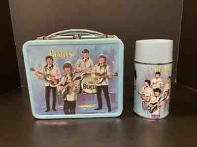 A vintage Annie lunchbox made by Aladdin which comes with a thermos and  does have wear. - Antique Mystique