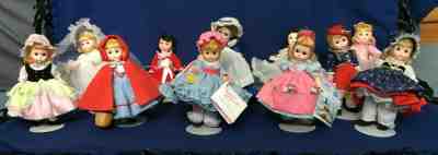 Lot of 11 Madame Alexander Storyland 8" Dolls, 1983-1984. Boxes, Tags, Stands.