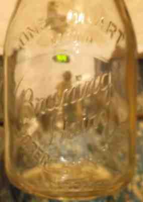 VERY OLD ROUND QUART EMBOSSED BRUNING DAIRY ROGERS CITY,MICHIGAN MILK BOTTLE