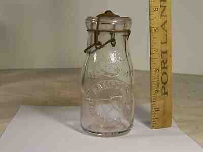 Milk bottle, half pint tin-top, Mass., Hampden Creamery, cow