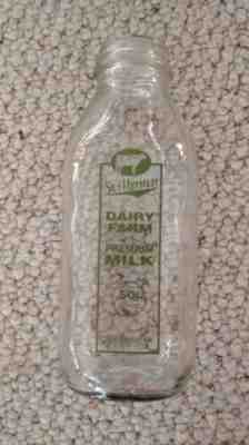 Stillman DAIRY Farm LUNENBURG MA quart milk bottle green COW 9