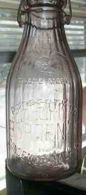 1912 Purple Borden's Milk Bottle With Wire Metal Cap Closure TMC Thatcher MFG