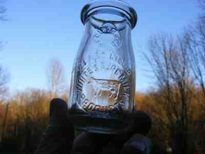  1/4 Pint White's Pure Milk Products , with Cow in Slug Plate center milk bottle