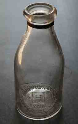 LARGE ROUND QUART LYNN MASSACHUSETTS MILK BOTTLE - H. P. HOOD & SONS