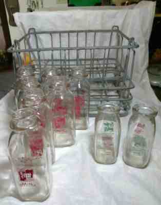 9 VINTAGE MILK BOTTLES & A STONE MANOR FARMS MILK CRATE FROM THE 40'S.