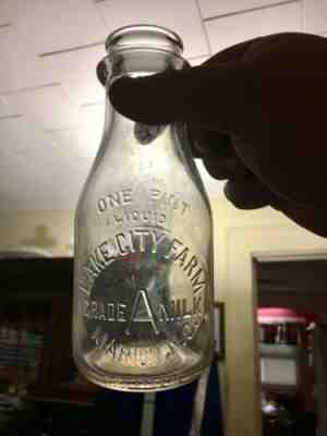 LAKE CITY FARM PINT EMBOSSED MILK BOTTLE. MARION NC NORTH CAROLINA