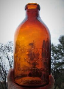 NICE EARLY HAND BLOWN HALF GALLON AMBER COLORED TIN TOP MILK BOTTLE