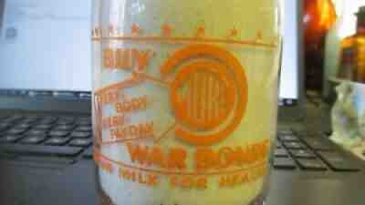 York, PA. Arnold's Dairy WAR BOND SLOGAN Milk Bottle TRPP BUY MORE WAR BONDS