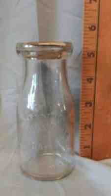 MILK BOTTLE. THURSTON'S DAIRY TAYLORSVILLE, N.C. 1/2 PINT