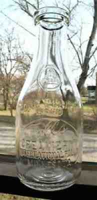 Rd QUART FALLS CREAMERY INTERNATIONAL FALLS MINNESOTA milk bottle