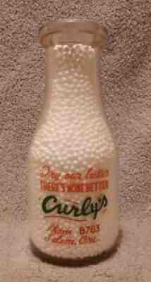 1950'S CURLY'S DAIRY. SALEM, OREGON. 1 PINT MILK BOTTLE.