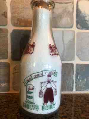 TRPQ 1948 green and maroon painted Curly's Dairy milk bottle from Salem, Oregon