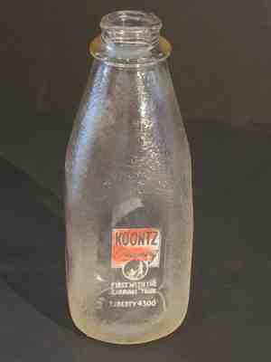 Quart Milk Bottle - Koontz Creamery - Carriage and Woman