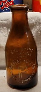 AMBER PEOPLES MILK CO. BUFFALO NEW YORK QUART EMBOSSED IN SLUG MILK BOTTLE