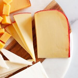 Dutch Gouda Cheese From Holland - Whole Wheel (10 pound) - hits the midpoint...