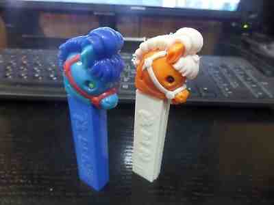 2 PEZ VINTAGE RARE HARD TO FIND  PONY GO ROUND WHITE HORSE BLUE PONY