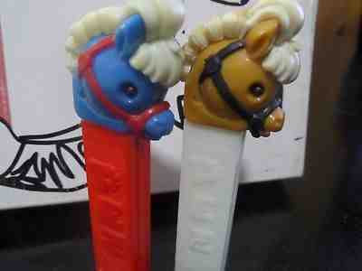 2 PEZ VINTAGE RARE HARD TO FIND  PONY GO ROUND WHITE HORSE BLUE PONY