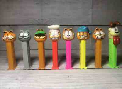 VINTAGE GARFIELD 1978 PEZ DISPENSER 8 LOT ODIE GREEN VISOR CHEF,PILOT AND MORE