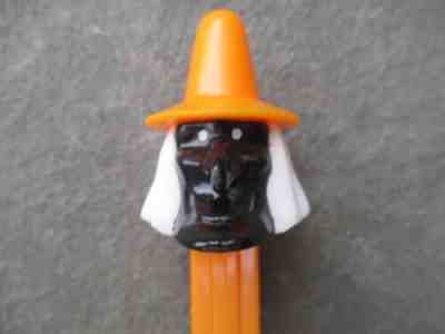 Pez MISFIT Black Voodoo Witch on Orange Stem with feet RARE